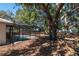 Screened-in pool with safety fence in backyard setting at 15123 Copeland Way, Spring Hill, FL 34604