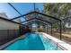 Relaxing screened pool with backyard view at 15123 Copeland Way, Spring Hill, FL 34604