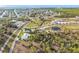 Aerial view of waterfront lot with modern home and canal access at 24502 Yacht Club Blvd, Punta Gorda, FL 33955