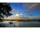 Person kayaking in a calm lake setting at 13271 Gulf Bay Ln, Spring Hill, FL 34609