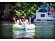 Personal relaxing on a tube in a river at 13271 Gulf Bay Ln, Spring Hill, FL 34609