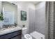 Bathroom with shower and gray tile at 7479 Rome Ln, Brooksville, FL 34613