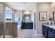 Modern bathroom with double vanity, soaking tub, and walk-in shower at 7479 Rome Ln, Brooksville, FL 34613
