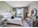 Serene bedroom with a white bedspread and green accents at 7479 Rome Ln, Brooksville, FL 34613