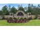 Waterford community entrance with stonework and landscaping at 7479 Rome Ln, Brooksville, FL 34613