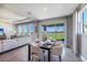 Casual dining area with a table and chairs, overlooking a lake view at 7479 Rome Ln, Brooksville, FL 34613