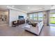 Living room with lake views and a modern media wall at 7479 Rome Ln, Brooksville, FL 34613