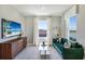 Relaxing living room with lake view and comfortable seating at 7479 Rome Ln, Brooksville, FL 34613