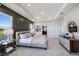 Main bedroom with water views and a stylish, dark-colored accent wall at 7479 Rome Ln, Brooksville, FL 34613