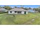 Single-story home with a large backyard and covered patio at 49 Marajo St, Punta Gorda, FL 33983