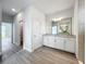Modern bathroom with white cabinets, granite countertop and walk-in shower at 49 Marajo St, Punta Gorda, FL 33983