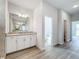 Modern bathroom with white cabinets, granite countertop and walk-in shower at 49 Marajo St, Punta Gorda, FL 33983