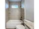 Updated bathroom with a shower/tub combo,granite vanity, and tile flooring at 49 Marajo St, Punta Gorda, FL 33983