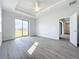 Bright bedroom with sliding glass doors and ceiling fan at 49 Marajo St, Punta Gorda, FL 33983