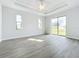 Bright bedroom with wood-look floors and large windows at 49 Marajo St, Punta Gorda, FL 33983