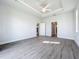 Spacious bedroom with wood-look floors and multiple doorways at 49 Marajo St, Punta Gorda, FL 33983