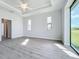 Bright bedroom with wood-look floors and large windows at 49 Marajo St, Punta Gorda, FL 33983