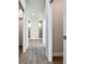 Bright hallway with wood-look floors and access to multiple rooms at 49 Marajo St, Punta Gorda, FL 33983