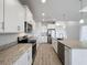 Modern kitchen with white cabinets and granite countertops at 49 Marajo St, Punta Gorda, FL 33983