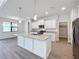 White kitchen cabinets, granite countertops and stainless steel appliances at 49 Marajo St, Punta Gorda, FL 33983