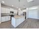 Modern kitchen with white shaker cabinets and granite countertops at 49 Marajo St, Punta Gorda, FL 33983
