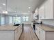 Spacious kitchen with granite counters, stainless steel appliances, and an island at 49 Marajo St, Punta Gorda, FL 33983
