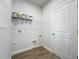 Convenient laundry room with shelving and space for washer/dryer at 49 Marajo St, Punta Gorda, FL 33983