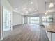 Open-concept living area with access to the kitchen and sliding glass doors at 49 Marajo St, Punta Gorda, FL 33983