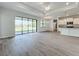 Open concept living area with kitchen and sliding glass doors at 49 Marajo St, Punta Gorda, FL 33983