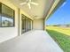 Covered patio with sliding glass doors and a view of the backyard at 49 Marajo St, Punta Gorda, FL 33983