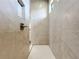 Large walk-in shower with tile surround and built-in shelving at 49 Marajo St, Punta Gorda, FL 33983