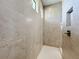 Bright walk-in shower with tile surround and built-in niche at 49 Marajo St, Punta Gorda, FL 33983