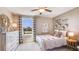 A bright, airy bedroom with white bedding and boho chic decor at 30942 Wild Juniper Ct, Brooksville, FL 34602