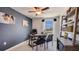 A home office with desk, chairs, bookshelves, and large window at 30942 Wild Juniper Ct, Brooksville, FL 34602