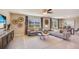 Spacious living area with plush seating, a patterned rug, and tasteful accents at 30942 Wild Juniper Ct, Brooksville, FL 34602