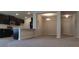 Open concept living space featuring tile flooring and a view into the kitchen at 13221 Gulf Bay Ln, Spring Hill, FL 34609