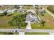 An elevated rear view reveals the pool deck beyond the lush foliage at 2457 Tamworth Ter, Punta Gorda, FL 33983