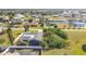 An elevated view showcases the rear pool deck, large roof, and surrounding neighborhood at 2457 Tamworth Ter, Punta Gorda, FL 33983