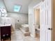 Bathroom featuring a step-up shower and soaking tub next to the toilet in a well lit space at 2457 Tamworth Ter, Punta Gorda, FL 33983