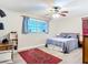 Comfortable bedroom with a ceiling fan, a patterned rug, and lots of natural light at 2457 Tamworth Ter, Punta Gorda, FL 33983