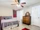 Cozy bedroom featuring a ceiling fan and wood floors, with plenty of natural light at 2457 Tamworth Ter, Punta Gorda, FL 33983