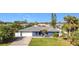 Beautifully landscaped single-story home with a well-maintained lawn at 2457 Tamworth Ter, Punta Gorda, FL 33983