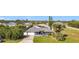 Charming single-story home with a well-manicured lawn, mature trees, and an attached two-car garage at 2457 Tamworth Ter, Punta Gorda, FL 33983
