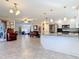 Open-concept kitchen with granite countertops that overlooks into a spacious living area at 2457 Tamworth Ter, Punta Gorda, FL 33983