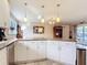 Modern kitchen with stainless steel appliances and ample counter space for cooking at 2457 Tamworth Ter, Punta Gorda, FL 33983