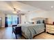 Relaxing main bedroom features wood floors and access to the back patio at 2457 Tamworth Ter, Punta Gorda, FL 33983