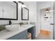 Modern bathroom vanity with dual mirrors, stylish sink, and decorative tile backsplash at 1731 Clearwater Harbor Dr, Largo, FL 33770