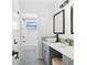 Modern bathroom with stylish vanity, basin sink, and tiled shower at 1731 Clearwater Harbor Dr, Largo, FL 33770