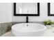 Close up view of a vessel sink in a remodeled bathroom with designer details at 1731 Clearwater Harbor Dr, Largo, FL 33770