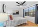 Comfortable bedroom with hardwood floors, stylish decor, and a large window at 1731 Clearwater Harbor Dr, Largo, FL 33770